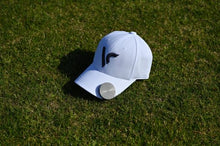 Load image into Gallery viewer, Voice GPS VC4 clipped on a white cap on the green
